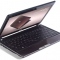 Фото Нетбук Acer Aspire One 721-128cc Cooper, вид слева спереди приоткрытый